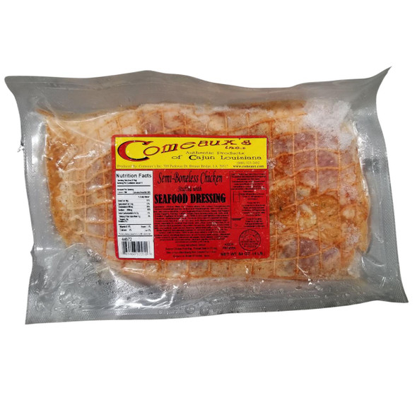 Comeaux's Stuffed Chicken w/ Seafood 4lb, packaged semi-boneless chicken stuffed with seafood dressing in clear vacuum-sealed plastic.