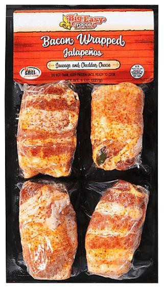 Big Easy Foods Bacon Wrapped Stuffed Jalapenos Sausage & Cheddar Cheese 4 Pack, packaged raw bacon-wrapped jalapenos on a black platter with a red and white label.