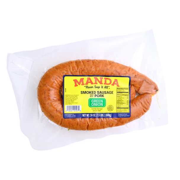 Manda Fine Meats Manda Smoked Pork Green Onion Sausage 24oz, packaged smoked sausage with green onion flavor in plastic wrap with yellow label.
