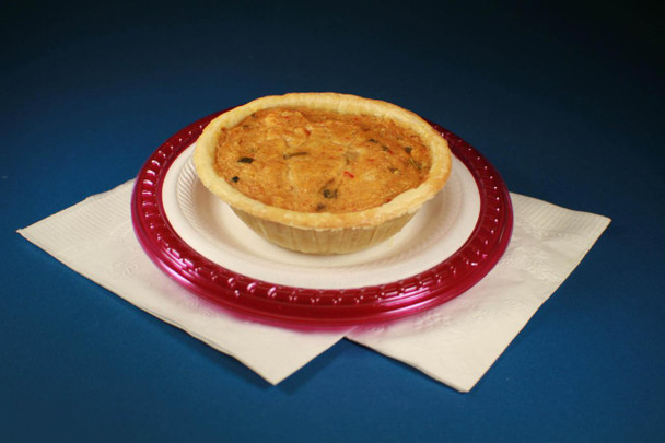 Cajun Original Mini Crawfish 15pk 5in BULK, savory crawfish pie with a golden crust on a decorative plate.