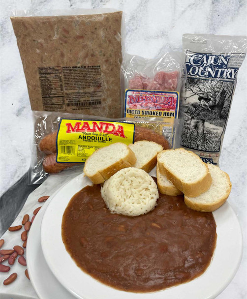 Creole Foods of Louisiana Red Bean Meal Kit, ingredients and cooked beans served with bread, smoked ham, and rice on a plate.