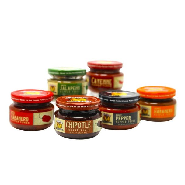 Pepper Puree Variety Pack, assortment of small glass jars with colorful labels and lids containing different flavored pepper purees.