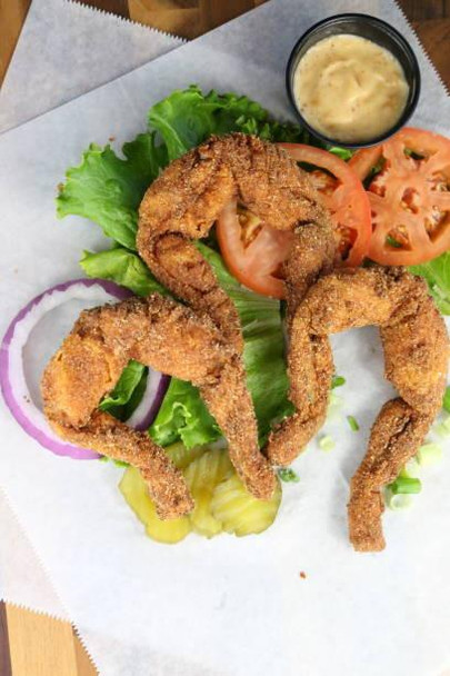JV Foods Frog Legs 4 - 6 ct - Medium - 5lb, fried frog legs served with fresh vegetables and dipping sauce.