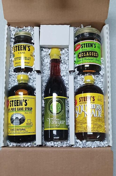 Steen's Collection 5 - Items, gift set with jars of cane syrup, molasses, apple vinegar, and blended syrup arranged in a box with shredded paper for presentation.