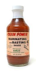 Cajun Power Marinating & Basting Sauce 16oz, bottle of flavorful Cajun marinating and basting sauce with a white cap and label.