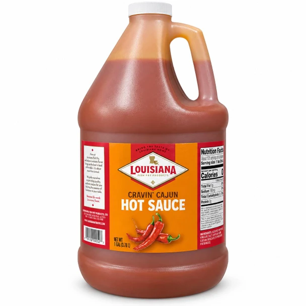 Louisiana Fish Fry Cravin Cajun Hot Sauce 128oz, large plastic jug of spicy red hot sauce with a white screw-on cap and a label featuring red and orange colors, a picture of red peppers, and nutrition facts.