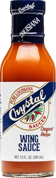Crystal Pure Louisiana Original Wing Sauce 12oz, a bottle of hot wing sauce with a blue cap and label, featuring chili peppers and the word 'Wing Sauce' prominently displayed.