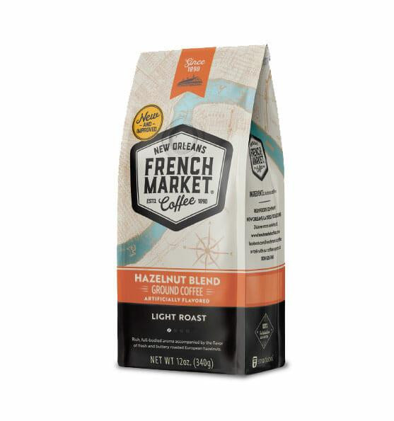 French Market Coffee Flavored Hazelnut 12 oz, bag of ground coffee with a beige and orange packaging design.