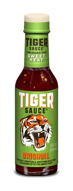 Try Me Tiger Sauce 5 oz, a green bottle with a white cap featuring a tiger graphic and bold text for spicy flavor.