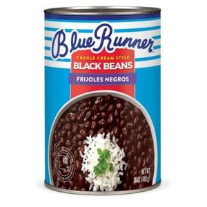 Blue Runner Creole Cream Style Black Beans 16oz, canned black beans with creole sauce, served with rice and garnished with herbs.