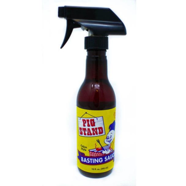 Pig Stand Cajun BBQ Basting Sauce 10oz, a brown bottle with a spray nozzle and a yellow label featuring a cartoon pig and the product name.