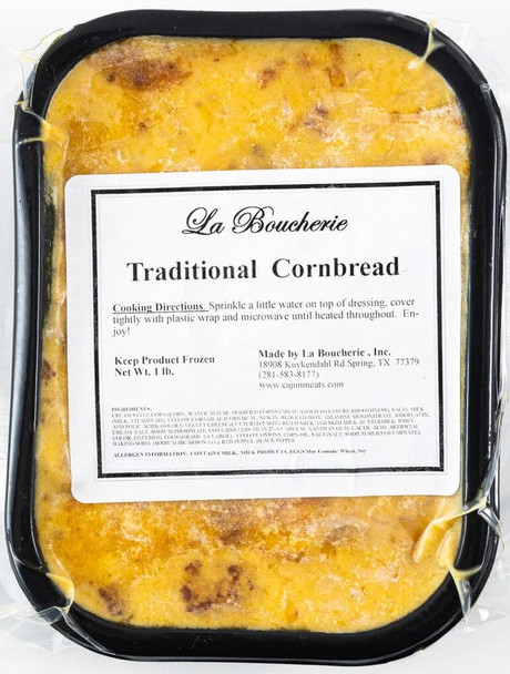 La Boucherie Jalapeno Cornbread Dressing 2 lb, packaged cornbread dressing with a golden-yellow crust, in a black baking dish with a label on top.