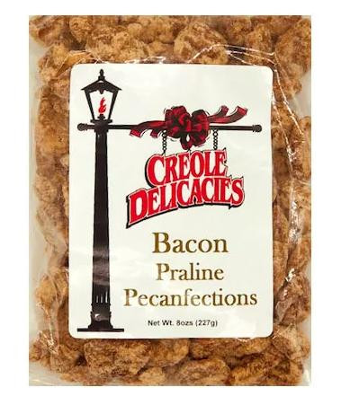 Creole Delicacies Bacon Praline Pecanfections, package of sweet pecan snacks with bacon pieces inside in clear plastic bag with label.