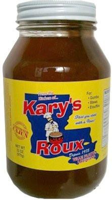 Kary's Roux Kary's Dark Roux 32oz, a jar of dark roux with yellow label and white lid used for cooking and flavoring dishes.