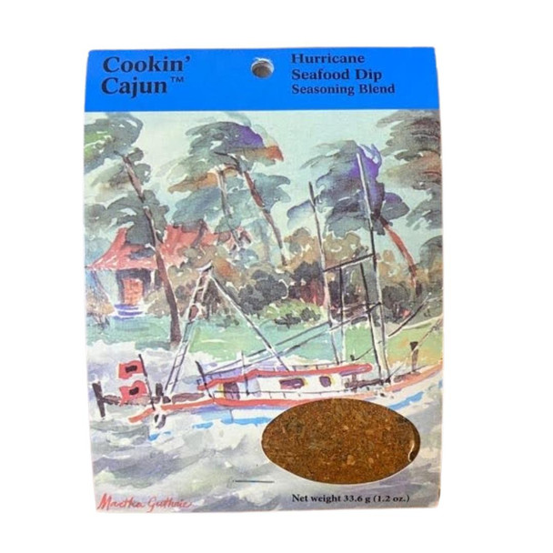 Cookin' Cajun Hurricane Seafood Dip, seasoning blend packet with an illustrated outdoor scene of trees and a boat on water.