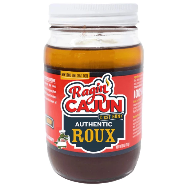 Ragin Cajun Roux 16oz, jar of authentic Cajun roux with red and black label, featuring a cartoon alligator chef holding a spoon.