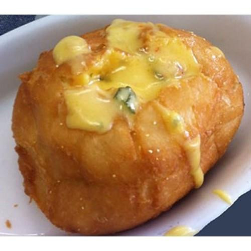 Comeaux's Crawfish Pistolettes 12 Pack, close-up of golden fried Armenian-style appetizer topped with melted cheese.