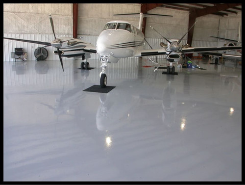 ArmorGarage Commercial Epoxy Floor In Airplane Hangar In Dark Gray