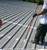 Metal Roof Coating - Screw Preparation With ArmorGarage Seam Mastic