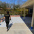 ARMORGARAGE RESURFINISH BEING ROLLED ONTO CONCRETE PATIO