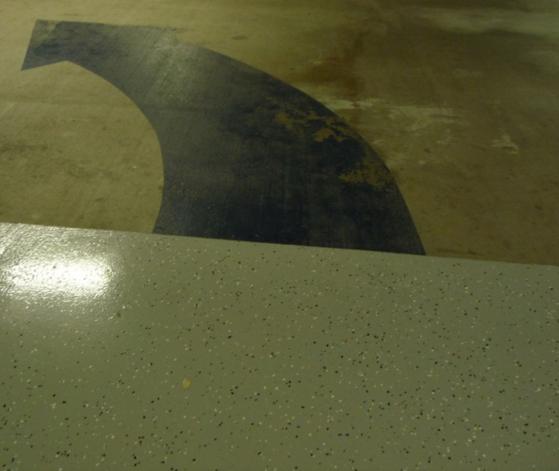 Worn Epoxy Arrow vs. Durable Floor
