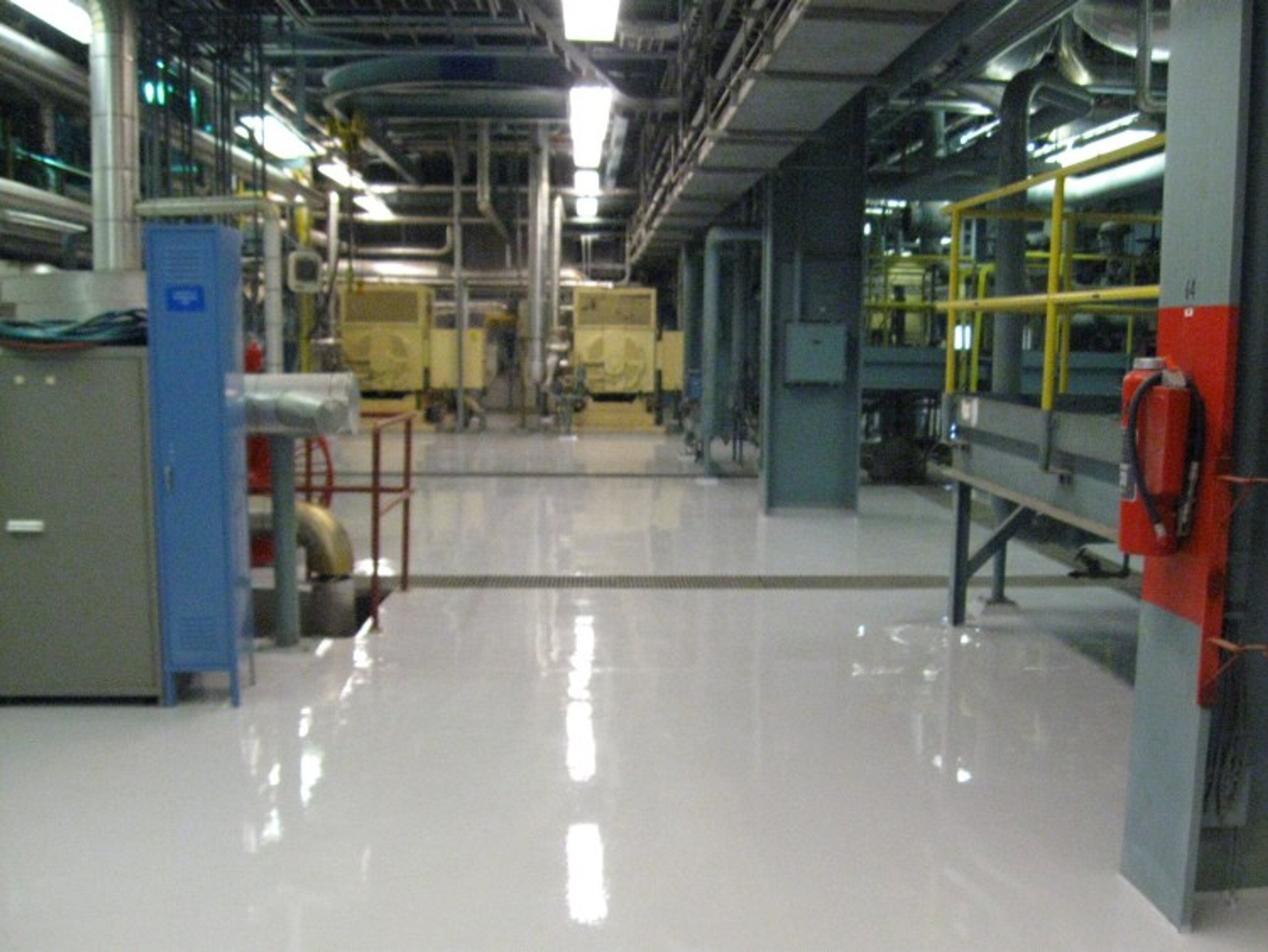 FACTORY PRODUCTION FLOOR DONE WITH HEAVY TONNAGE EPOXY FLOOR COATING