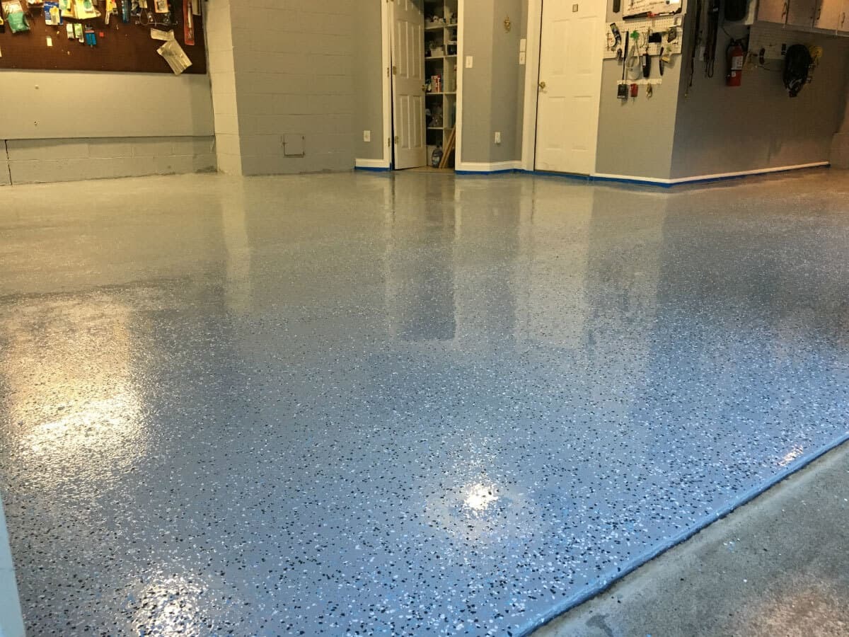 Garage floor after Armor Chip gray epoxy coating with flakes