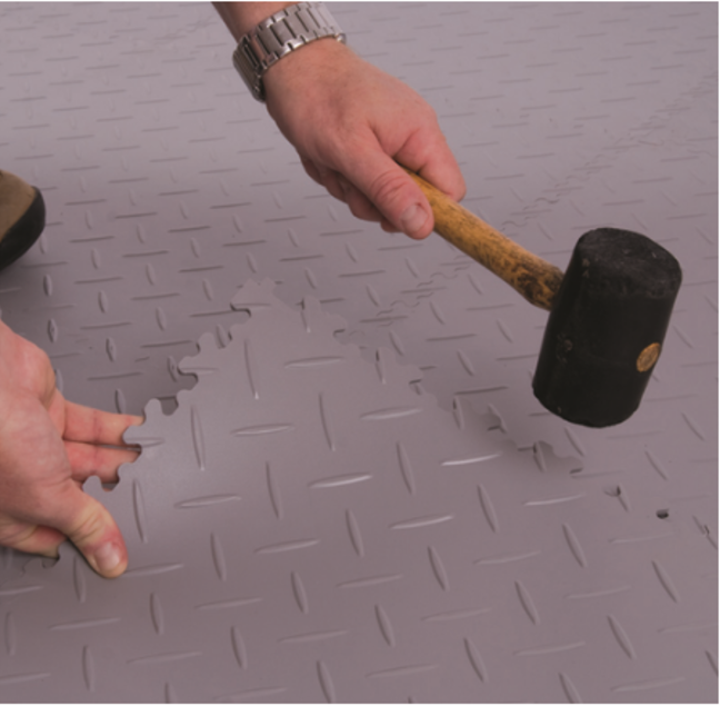 Installing ArmorGarage Floor Tiles With Rubber Mallet
