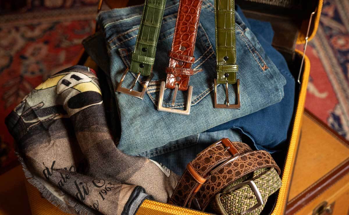 Torino Leather Belts in a suitcase.