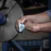 CP193 - Worker cleaning greasy hands with a Vinco-TuffScrub Industrial Tool & Hand Wipe