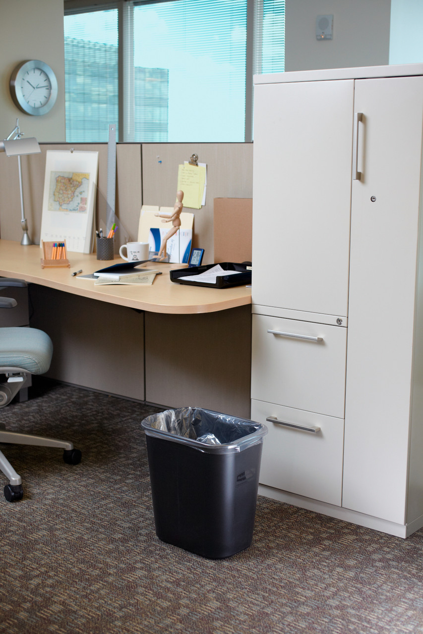 FG295600BLA - The wastebasket is situated in an office and is placed by a filing cabinet