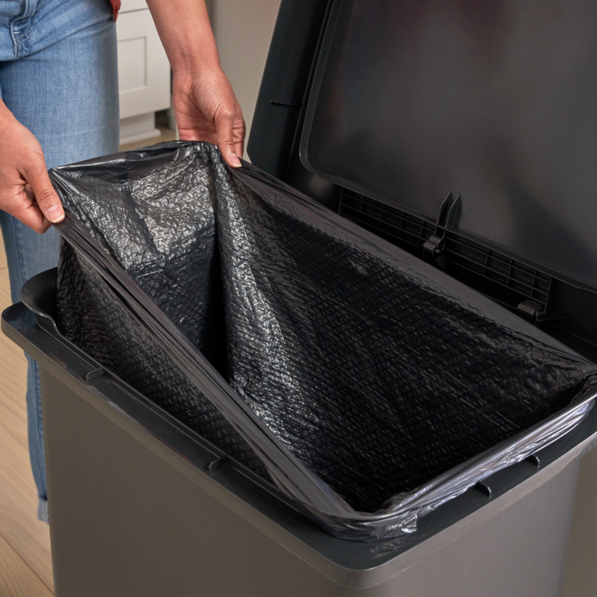 Man Installing Black Liner in Single Stream Configuration