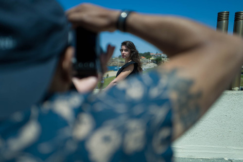 Photographer directing outdoor portrait shoot using natural light