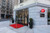 Street-level view of Leica Store Boston storefront with red carpet entry