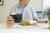 Instructor holding Leica M camera reviewing notes