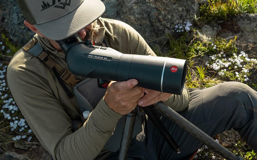 Man looking through Leica Televid Spotting Scope