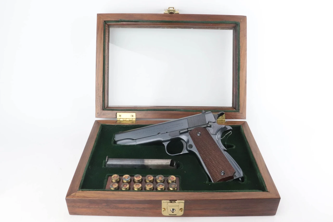 1924 transitional Colt 1911A1 in display case - in display case