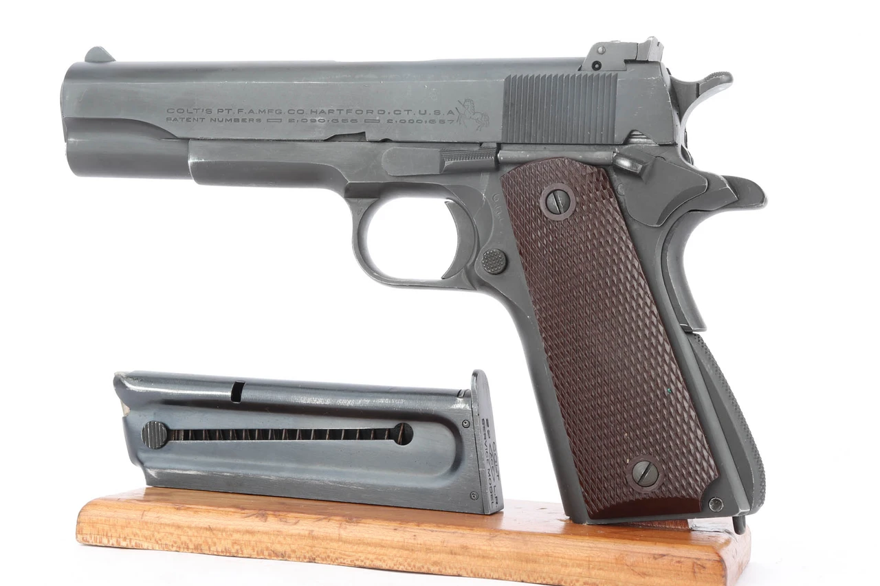 1945 Colt Service Model ACE .22 pistol - left side with magazine
