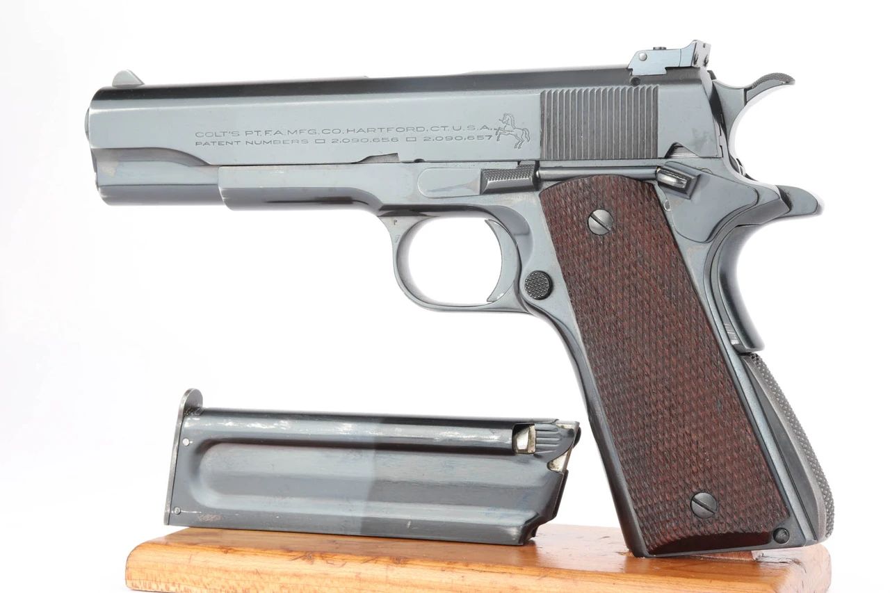 1939 Colt Service Model ACE .22 LR pistol - left side with magazine