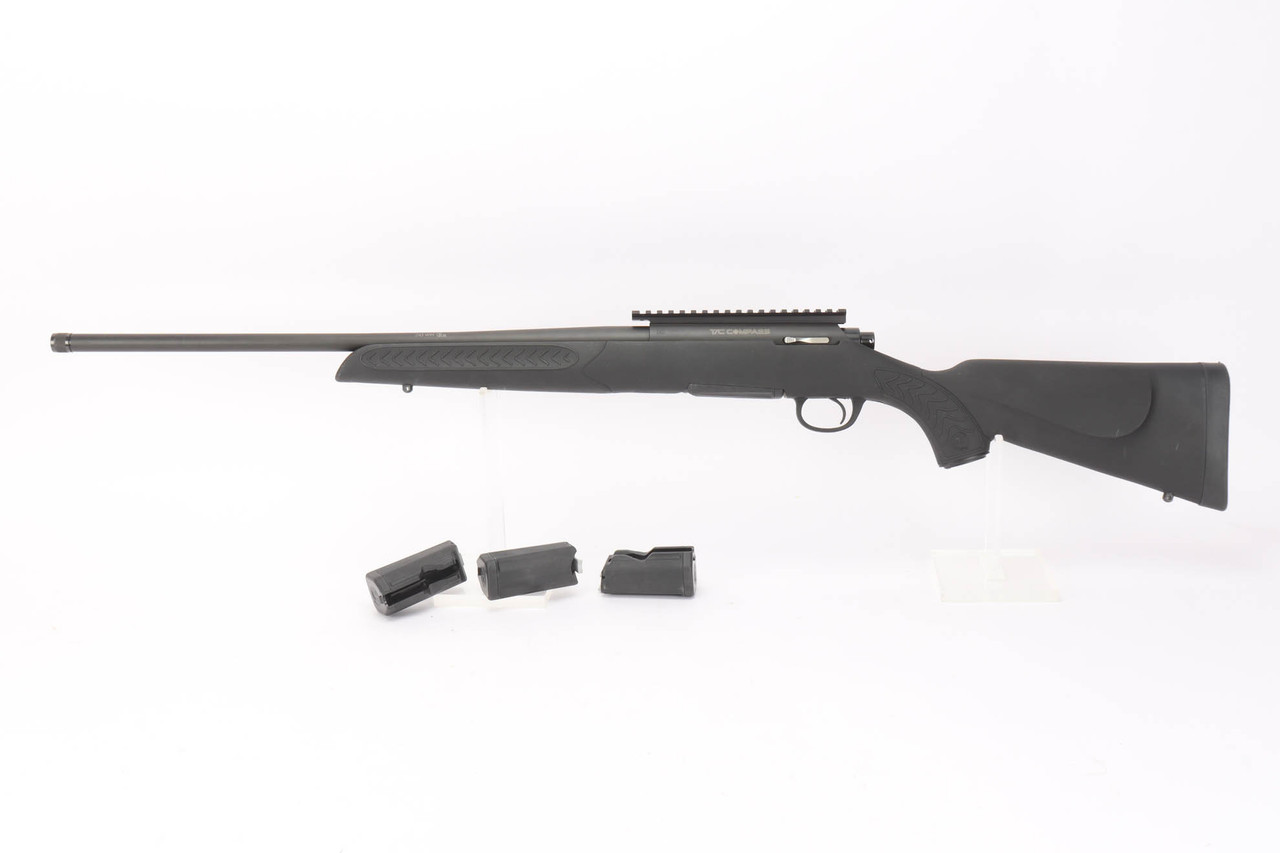 Thompson Center Compass .243 Winchester rifle with extra magazines - left side full view with magazines