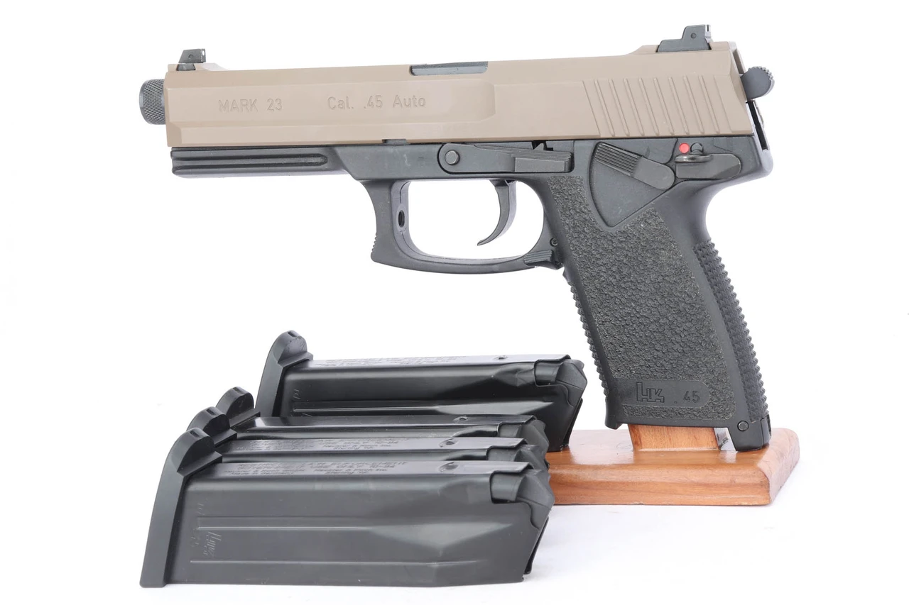HK Mark 23 .45 pistol - left side with magazines