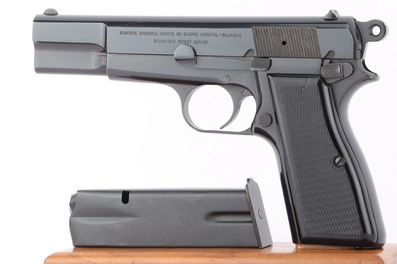 1968 FN Browning High Power T series 9mm pistol - left side view with magazine