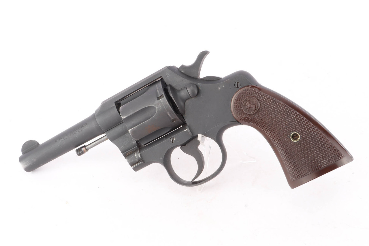 1943 Colt Commando .38 Special revolver - left side view with reddish plastic grips