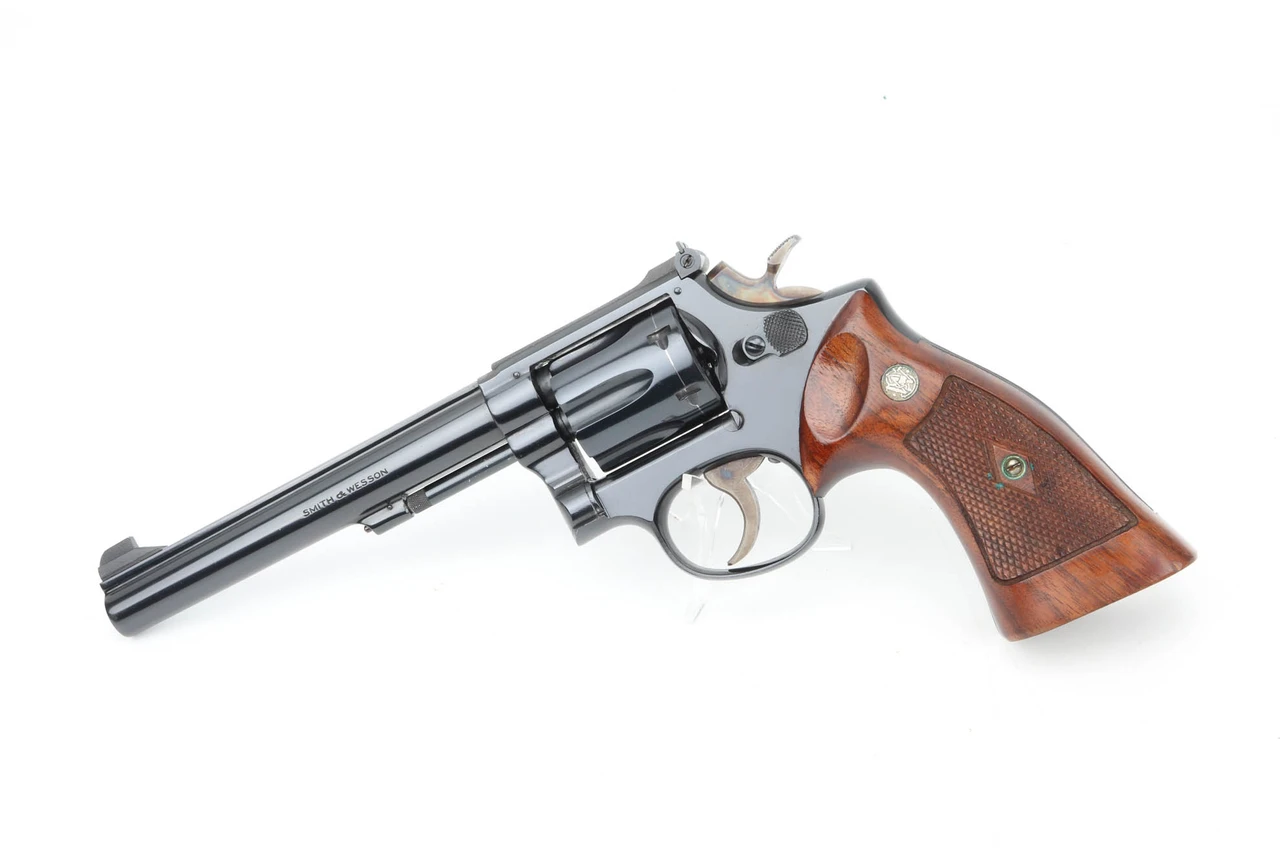 1958 Smith & Wesson Model 17 .22 LR revolver - left side view, high polish blue