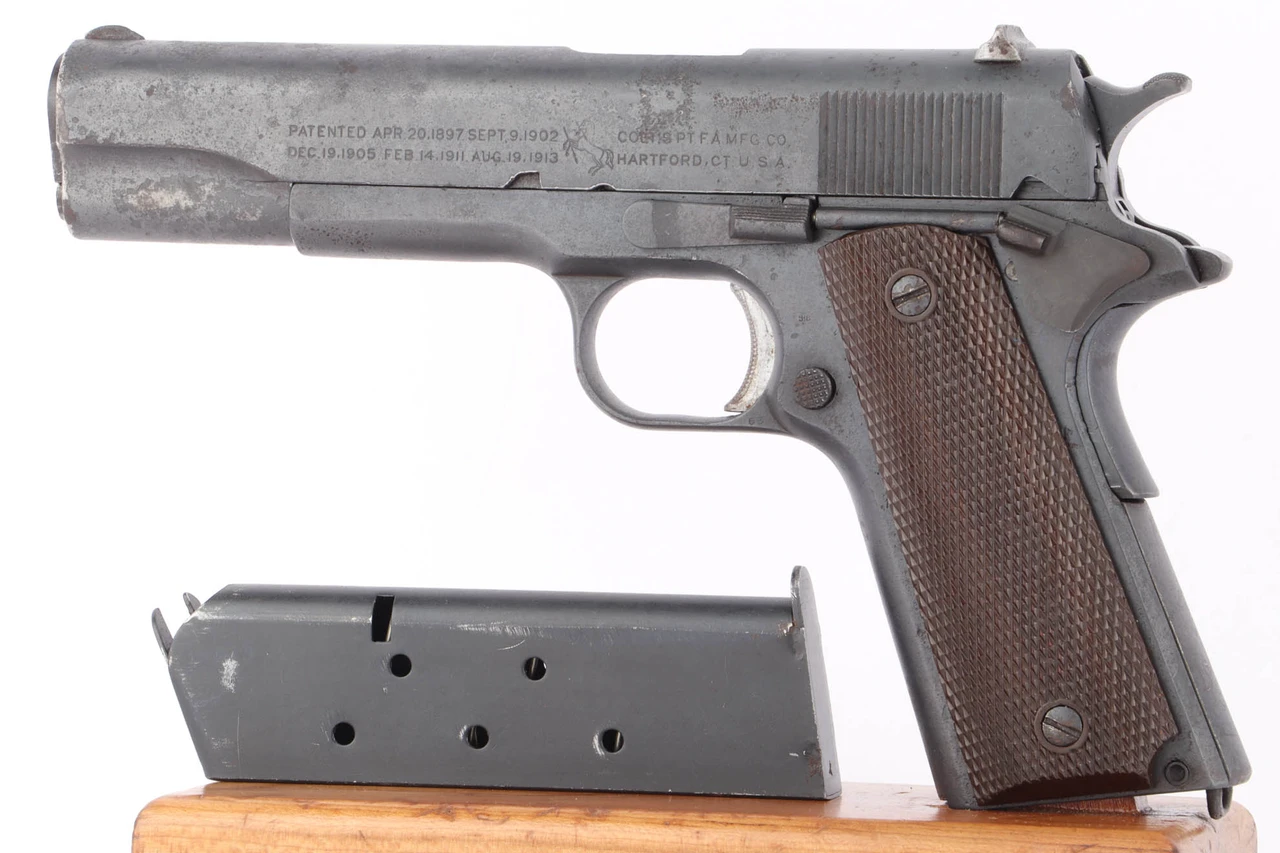 1918 US Army Colt Model 1911 .45 ACP pistol - left side view with magazine