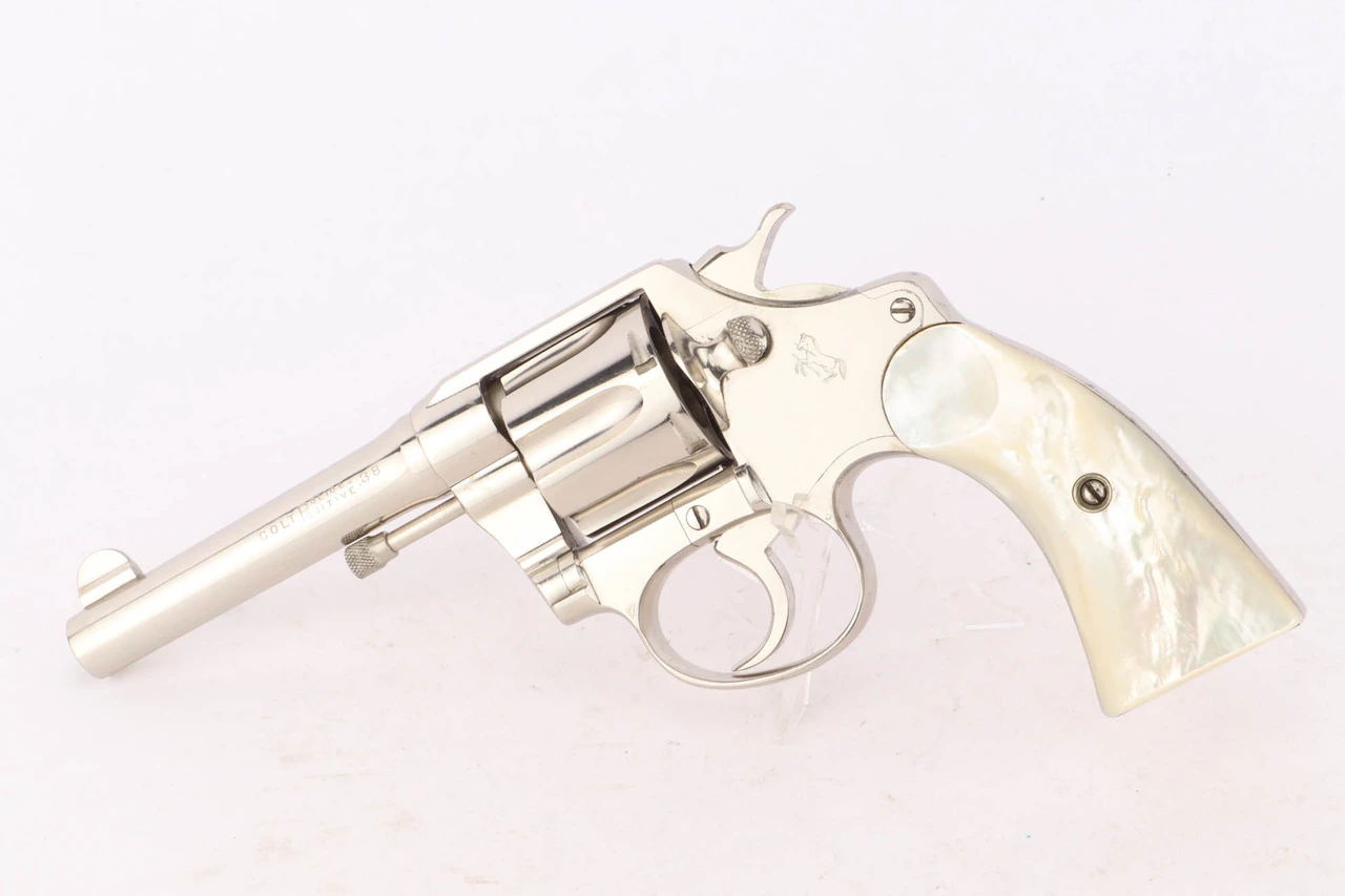 1916 Colt Police Positive .38 revolver - left side view, nickel finish and mother of pearl grips
