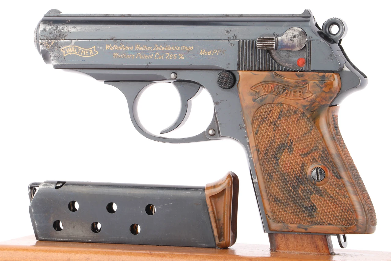 1933 Walther PPK 7.65mm with Graf Zeppelin inscription - left side view with finger extension magazine