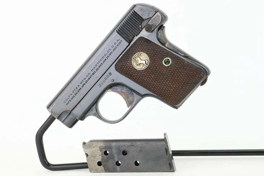 1926 Colt Model 1908 Vest Pocket .25 ACP pistol - left side view with magazine