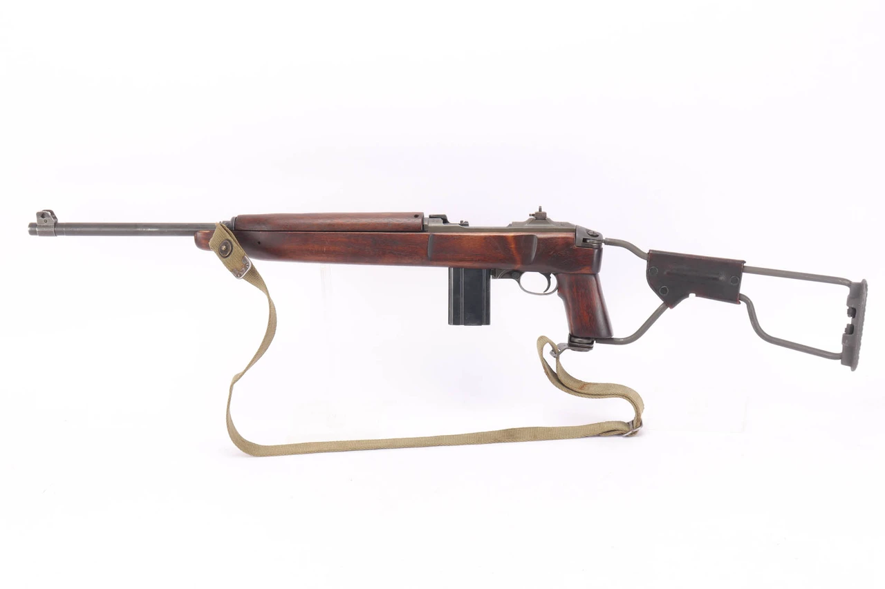 1943 Inland M1A1 Paratrooper .30 Carbine - left side view with folding stock extended and web sling
