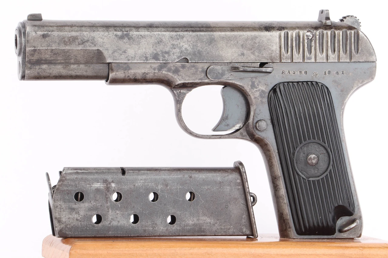 1941 Russian Tokarev TT-33 7.62x25 pistol - left side view with matching magazine